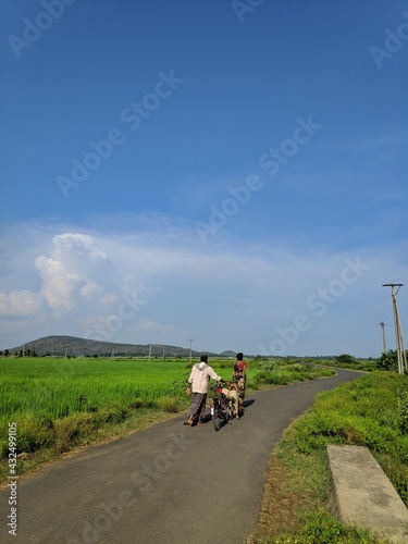 Hyderabad, India - may 08, 2021: farmers are going to the agriculture fields to work day