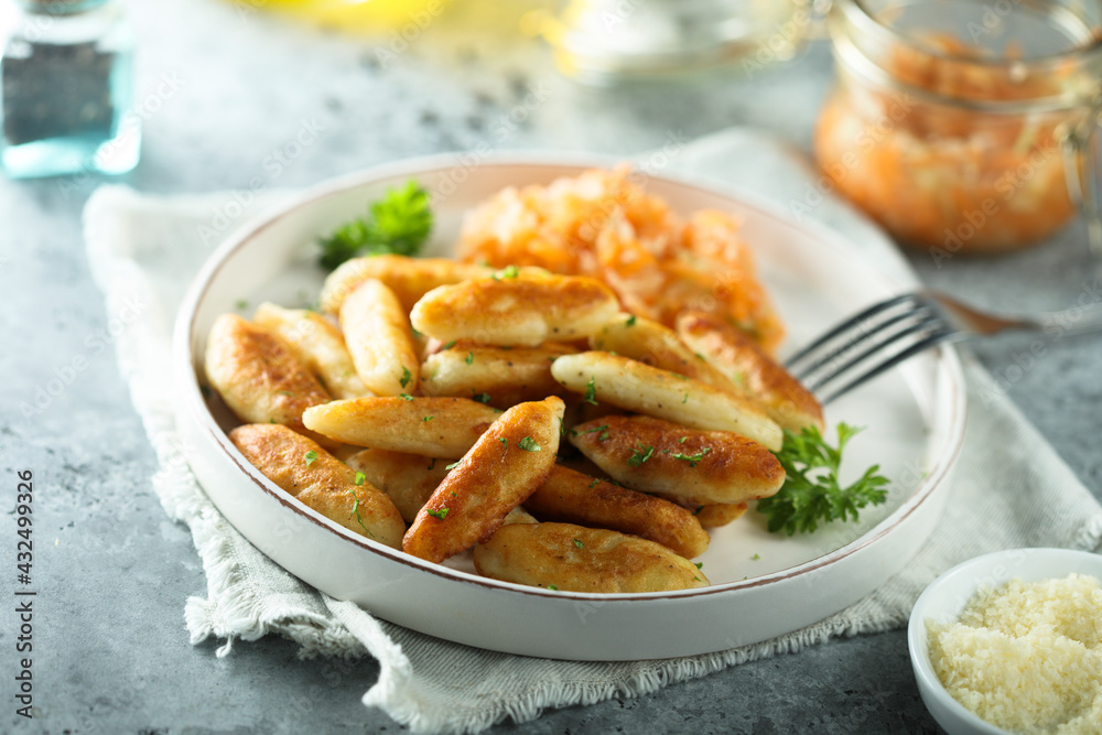 Traditional German potato dumplings served with parsley Traditional German potato dumplings served with parsley