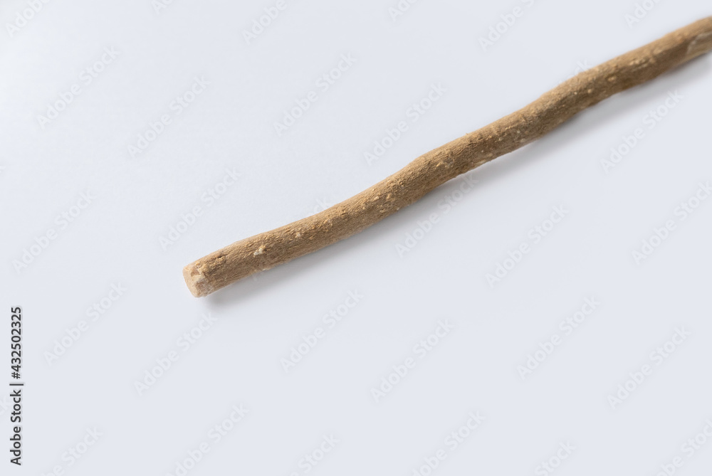 The miswak, miswaak, siwak, sewak, Arabic is a teeth cleaning twig made from the Salvadora persica tree. Miswak isolated on white. The miswak, miswaak, siwak, sewak, Arabic is a teeth cleaning twig made from the Salvadora persica tree. Miswak isolated on white.
