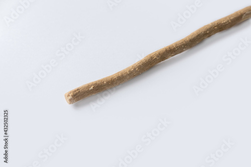 The miswak, miswaak, siwak, sewak, Arabic is a teeth cleaning twig made from the Salvadora persica tree. Miswak isolated on white.