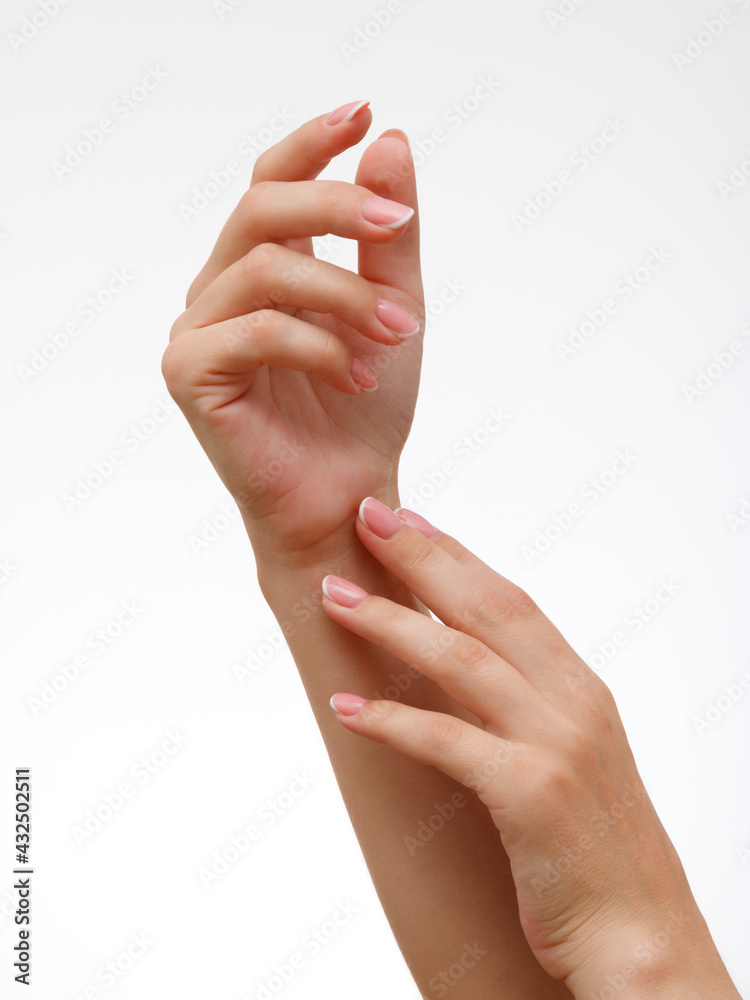 Beautiful Woman Hands . Spa and Manicure concept . Female hands with french manicure. Soft skin, skincare concept. Beauty nails Beautiful Woman Hands . Spa and Manicure concept . Female hands with french manicure. Soft skin, skincare concept. Beauty nails
