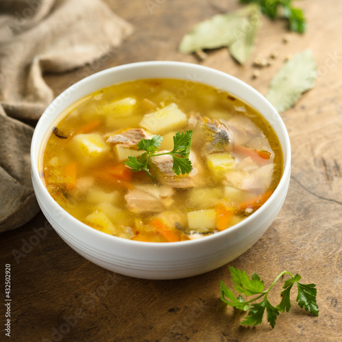 Traditional homemade salmon soup with vegetables
