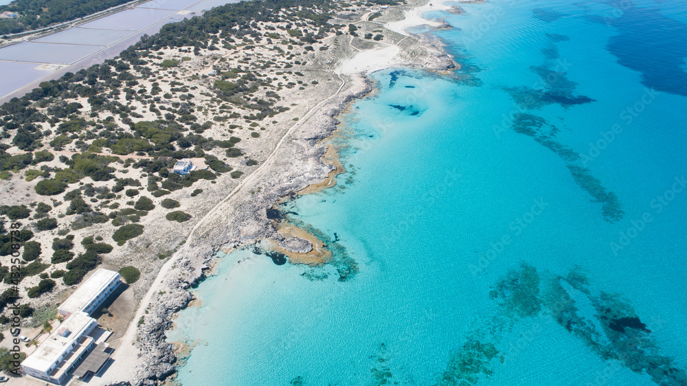 Sunny day on amazing beach with turquoise sea seen from a drone