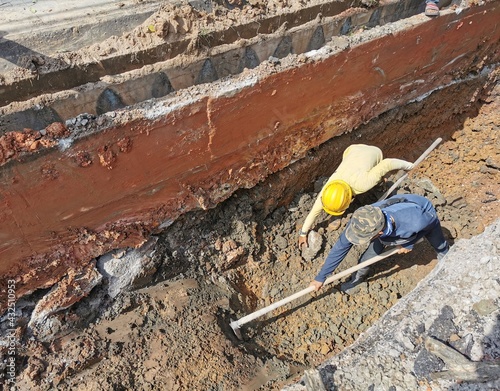 Worker build underground cable