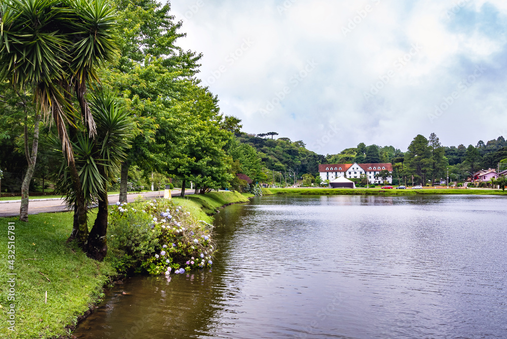 a lake with a country house