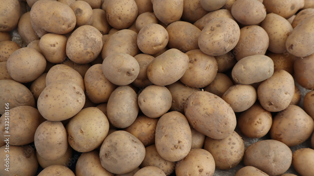 Unpeeled raw potatoes background at the vegetable market in Turkey Unpeeled raw potatoes background at the vegetable market in Turkey