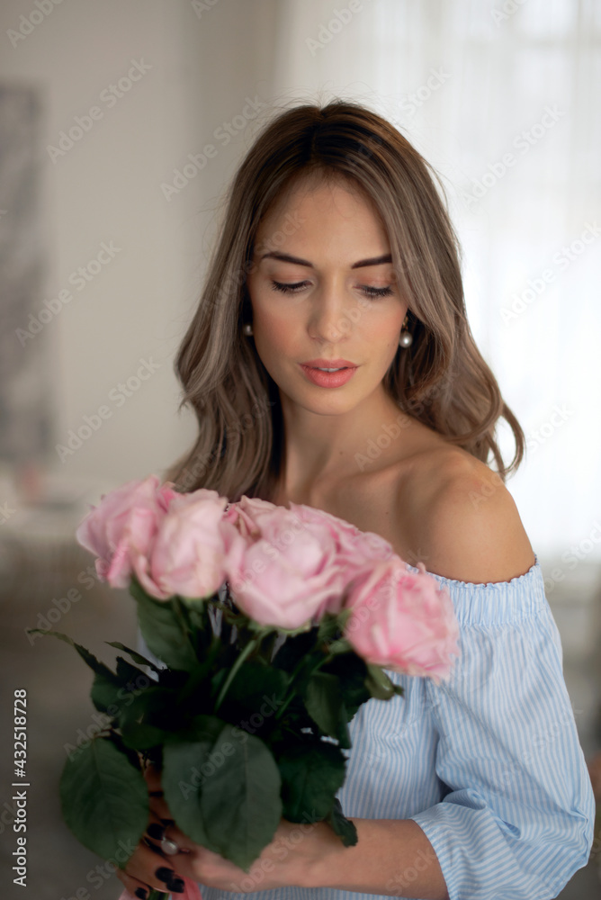 beautiful attractive woman holding bouquet roses at home looking down beautiful attractive woman holding bouquet roses at home looking down