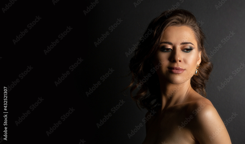 Glamor brunette woman with bare shoulders