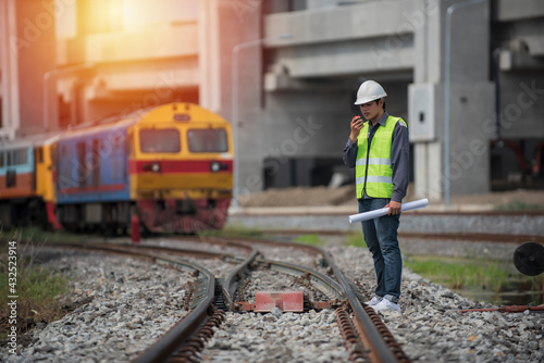 Engineer on railways. engineer train on the railway. Worker walk on railway. engineer railway concept. infrastructure, rails, engineer.