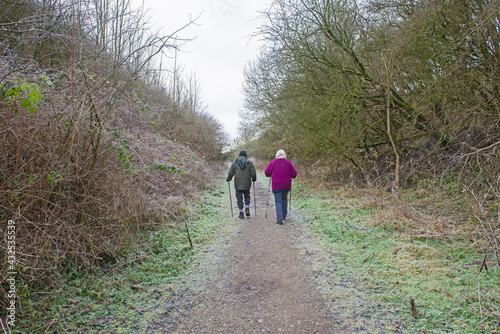 Couple walking on footpath through rural countryside woodland © Paul Vinten