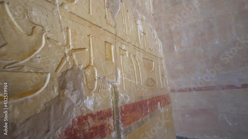 Bird hieroglyph in Mortuary Temple of Hatshepsut and fresco wall paint around temple photo