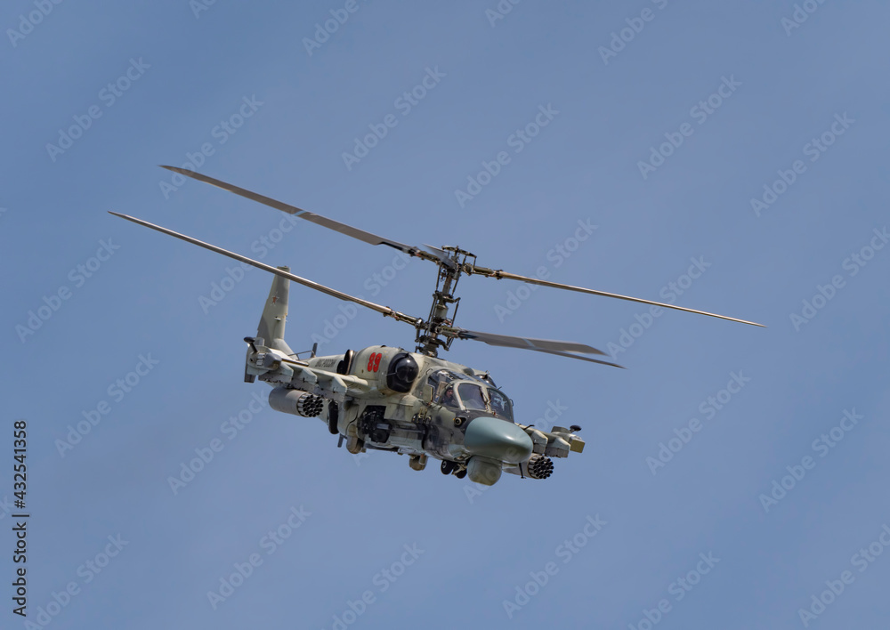 Fototapeta premium ZHUKOVSKY, RUSSIA - SEPTEMBER 01, 2019: Demonstration of the Kamov Ka-52 Alligator attack helicopter of the Russian Air Force at MAKS-2019, Russia.