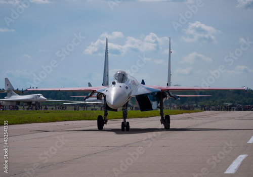 The Russian Knights Russkie Vityazi aerobatic team performs a demonstration flight with aerobatics figures of the international aerospace salon MAKS-2019