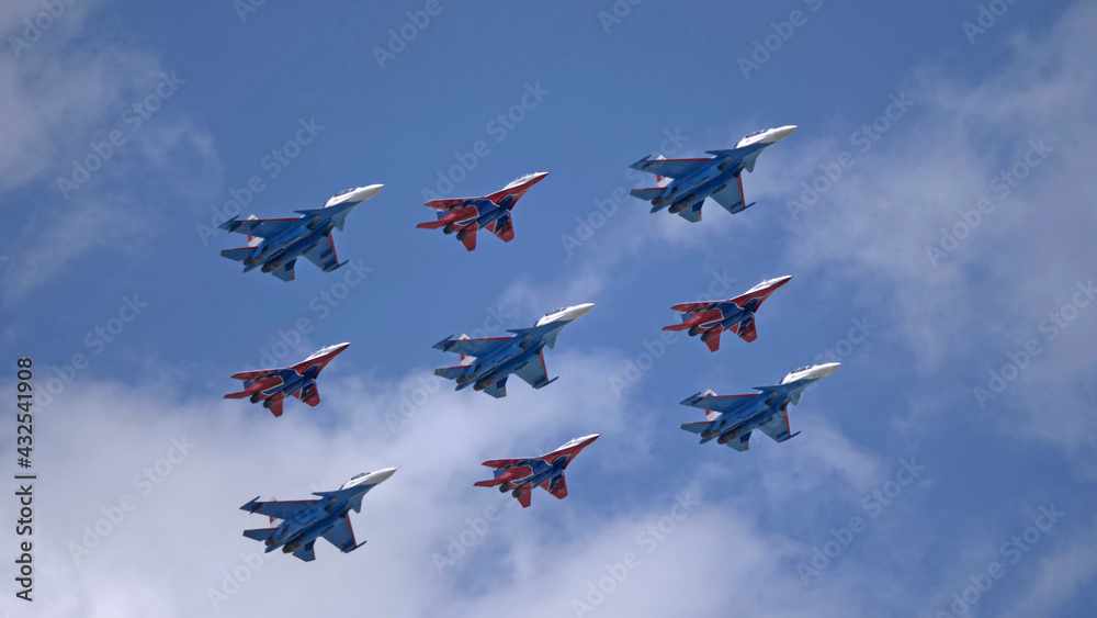 MOSCOW, RUSSIA - MAY 7, 2021: Avia parade in Moscow. group jet fighter aircraft MiG-35 and Su-30 in the sky on parade of Victory in World War II in Moscow, Russia MOSCOW, RUSSIA - MAY 7, 2021: Avia parade in Moscow. group jet fighter aircraft MiG-35 and Su-30 in the sky on parade of Victory in World War II in Moscow, Russia