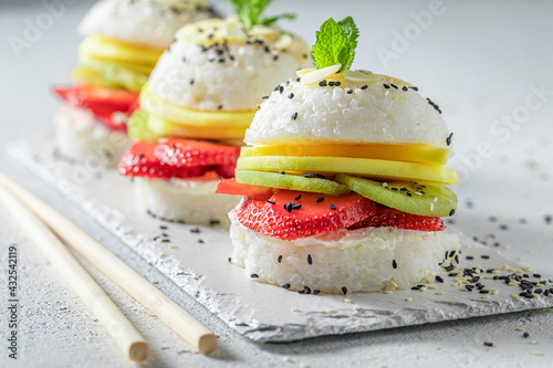 Exquisite sush burger with mascarpone and strawberries as Japanese dessert. photo