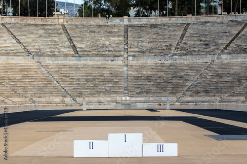Panathenaic stadium (Kallimarmaro) with the podium of winners blurred in front of. It is the only stadium in the world built entirely of marble. 