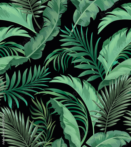 Green tropical palm leaves seamless vector pattern on the black background.Trendy summer print.