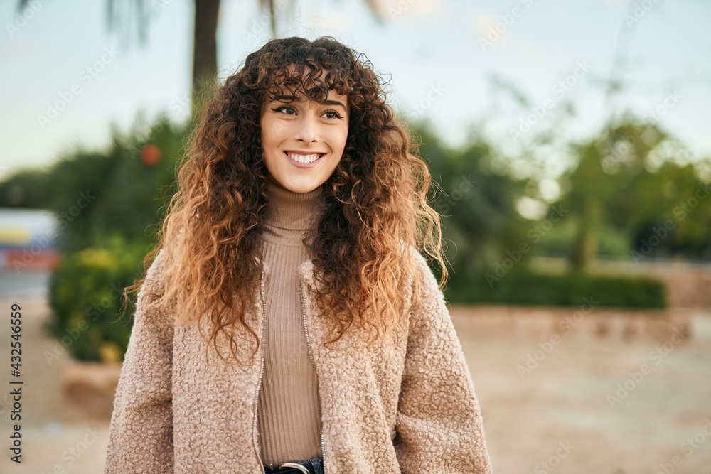 Young hispanic woman smiling happy standing at the city Young hispanic woman smiling happy standing at the city