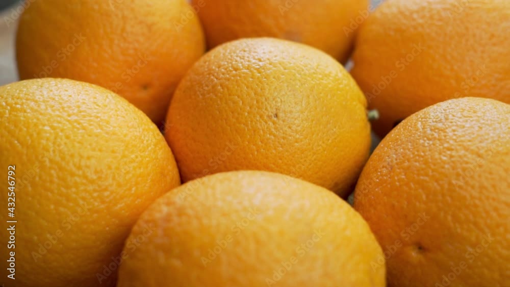 Fresh Whole Oranges, Close-up, Rotate. Background of Oranges and Citrus Fruits. Oranges Are Isolated. Healthy Vitamin-Rich Vegan Food and Vegetarian Diet. Fresh Whole Oranges, Close-up, Rotate. Background of Oranges and Citrus Fruits. Oranges Are Isolated. Healthy Vitamin-Rich Vegan Food and Vegetarian Diet.
