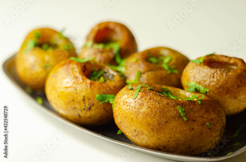 Mini jacket potatoes with a fragrant garlic butter infused with Italian truffle oil © Q77photo