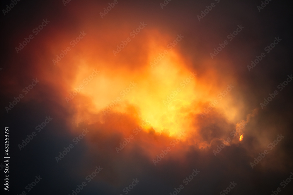 Fiery burst of sunlight break in the dark clouds - beautiful spectacular sunset Fiery burst of sunlight break in the dark clouds - beautiful spectacular sunset