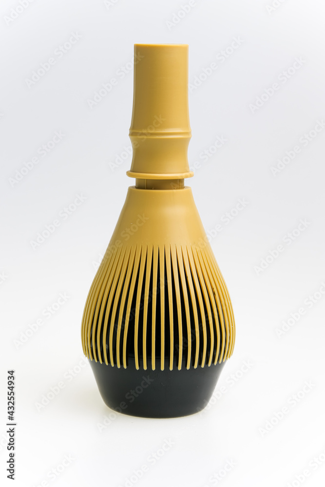 Japanese green tea matcha Chasen bamboo whisk and traditionally Japanese bowl isolated in white background. Japanese green tea matcha Chasen bamboo whisk and traditionally Japanese bowl isolated in white background.