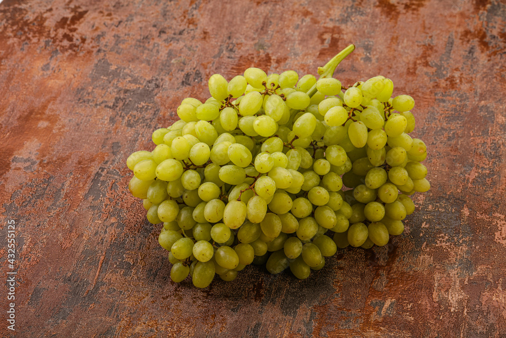Green grape branch over background Green grape branch over background