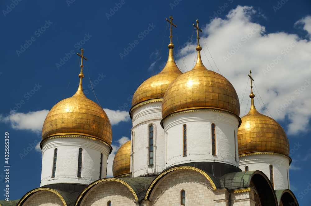 Golden domes of Assumption Cathedral. This Russian Orthodox church dedicated to the Dormition of the Theotokos is located on the north side of Cathedral Square of the Moscow Kremlin.