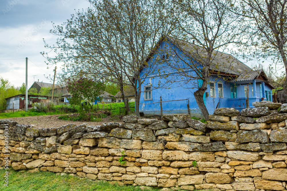 Fototapeta premium landscape with old, forgotten house, abandoned somewhere in the villages of Moldova. Abandoned house in Republic of Moldova. Depopulation concept.