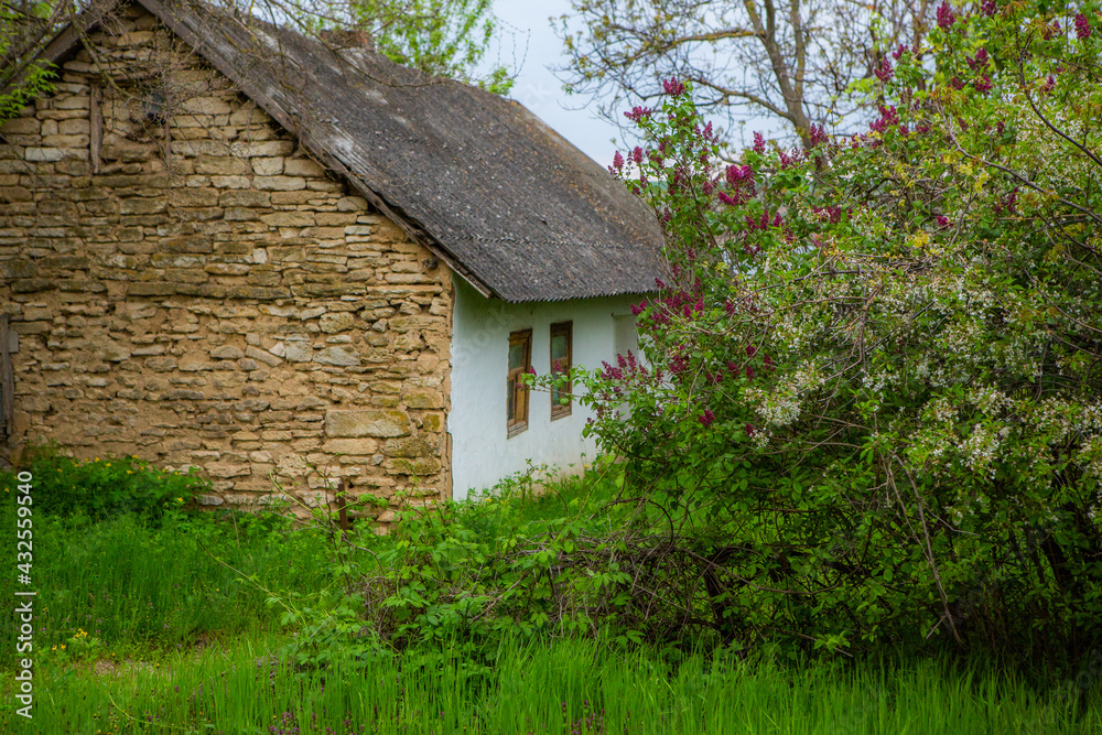 landscape with old, forgotten house, abandoned somewhere in the villages of Moldova. Abandoned house in Republic of Moldova. Depopulation concept.