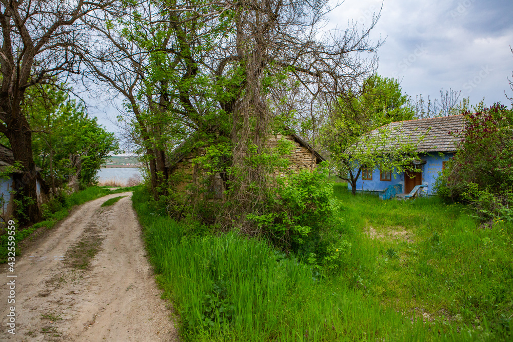 landscape with old, forgotten house, abandoned somewhere in the villages of Moldova. Abandoned house in Republic of Moldova. Depopulation concept.