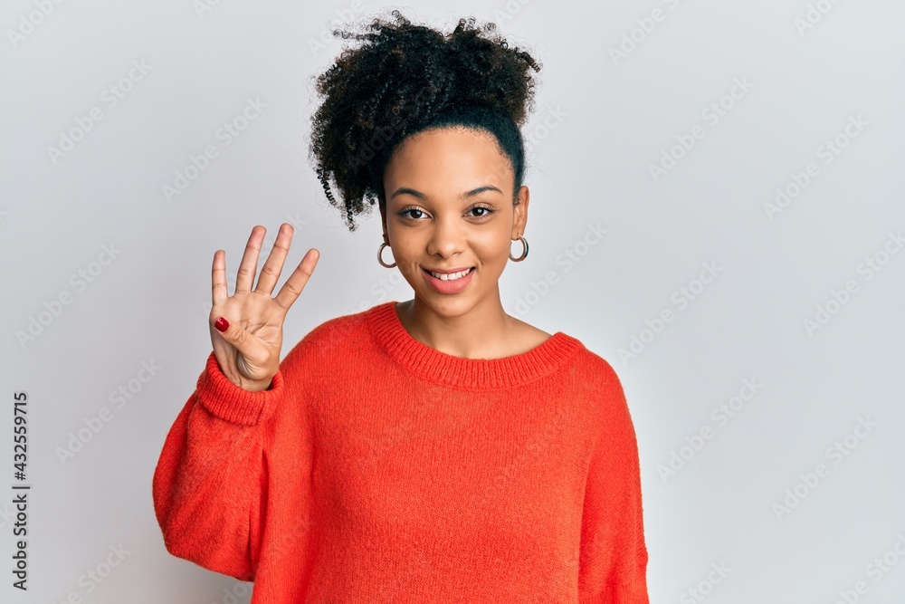 Young african american girl wearing casual clothes showing and pointing up with fingers number four while smiling confident and happy. Young african american girl wearing casual clothes showing and pointing up with fingers number four while smiling confident and happy.