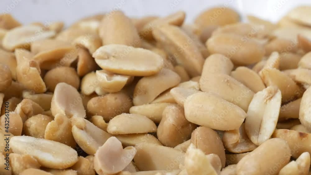 Peanuts falling into a bowl slow motion slider shot
Peanuts falling into a bowl slow motion slider shot