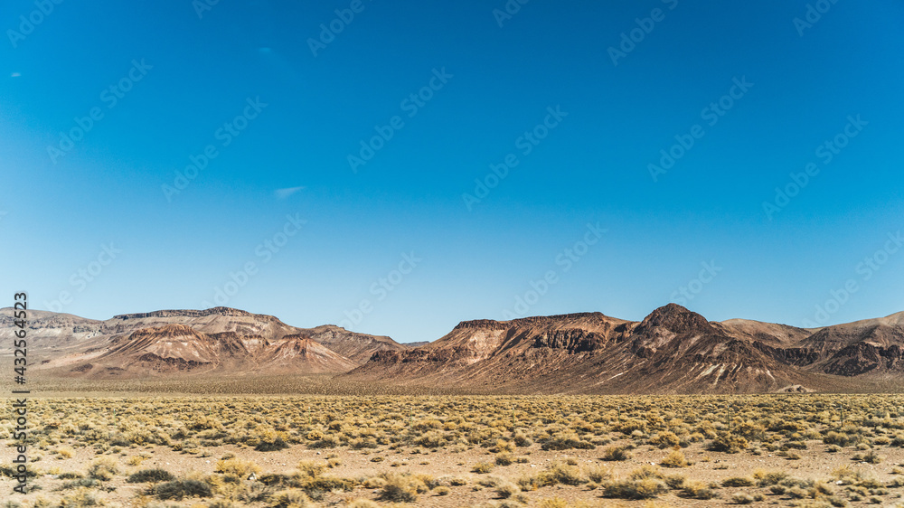 Arid Mountains landscape against clear blue sky in Nevada
