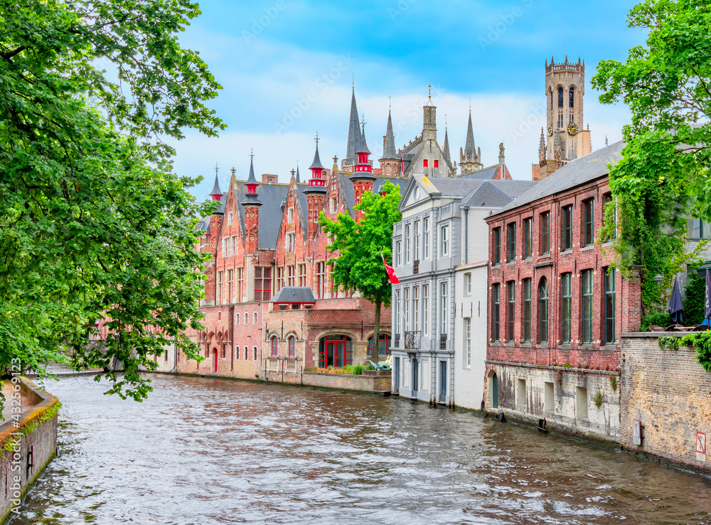 Groenerei canal and architecture of old Bruges with Belfort tower, Belgium