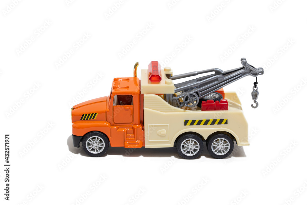 Toy tow truck on a white background. Children's car for transporting cars.