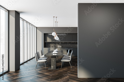 Empty grey wall copy space. Interior of modern kitchen with wooden floor, furniture, table and chairs, panoramic window. Dining room. Oak parquet. Home architecture concept. Mockup.