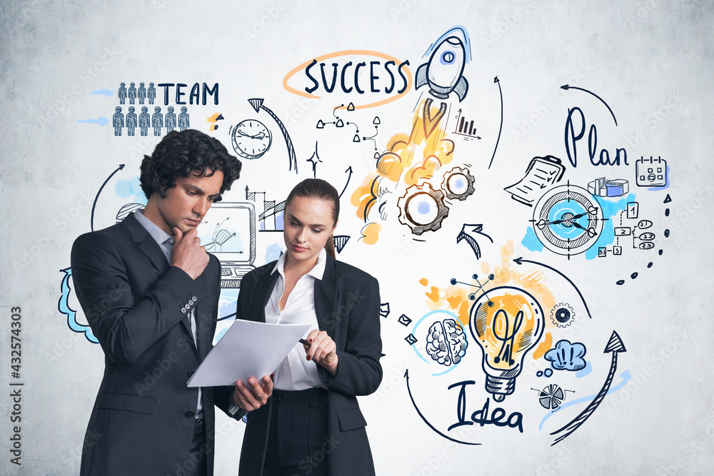 Business people with papers, business strategy sketch on concrete wall Business people with papers, business strategy sketch on concrete wall