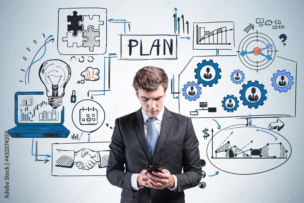 Businessman in suit using phone in hands, business plan and network drawing Businessman in suit using phone in hands, business plan and network drawing