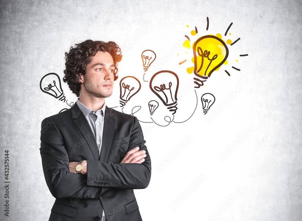 Businessman standing with arms crossed smiling, light bulbs sketch Businessman standing with arms crossed smiling, light bulbs sketch