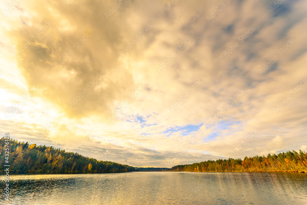 Fototapeta premium Evening on a forest lake. View from the shore level