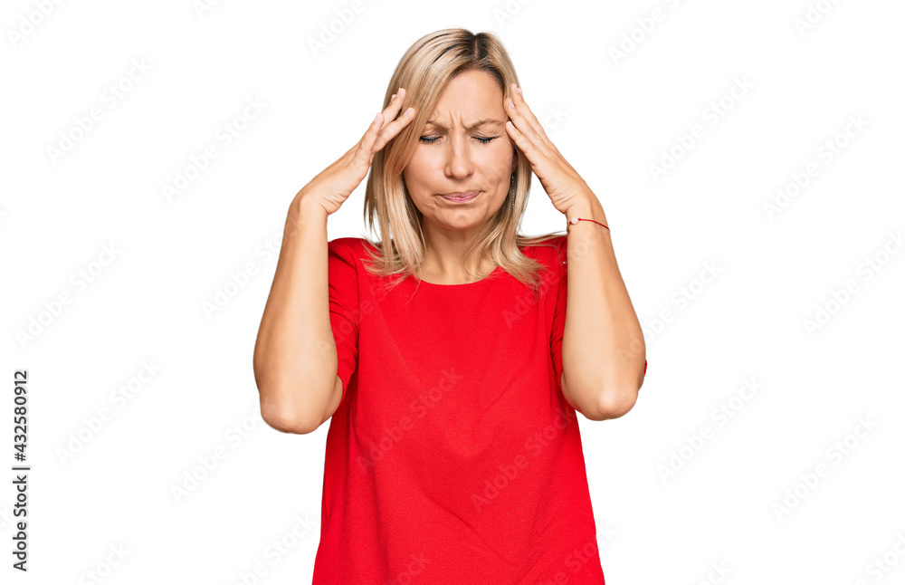 Middle age caucasian woman wearing casual clothes with hand on head for pain in head because stress. suffering migraine. Middle age caucasian woman wearing casual clothes with hand on head for pain in head because stress. suffering migraine.