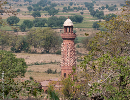 unusual tower, the hiran minar, at fatephur sikri near agra- decorated with stone elephant tusks photo