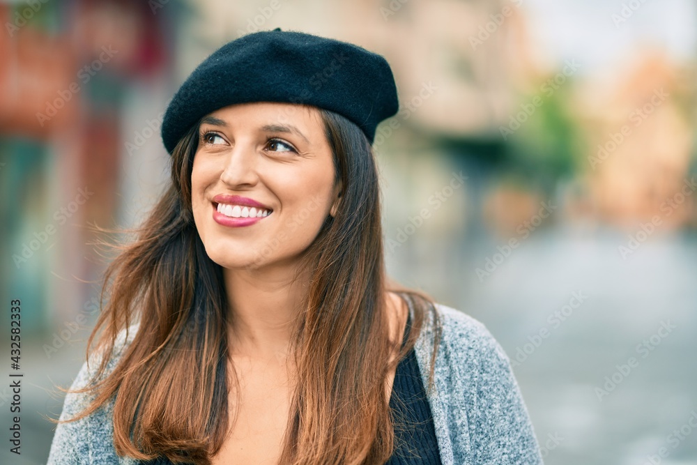 Young latin woman wearing french style standing at the city. Young latin woman wearing french style standing at the city.