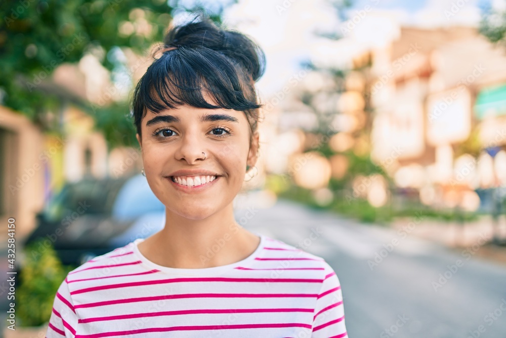 Young hispanic girl smiling happy walking at the city. Young hispanic girl smiling happy walking at the city.