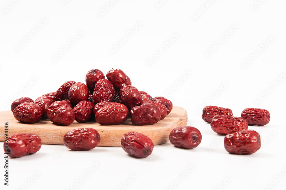 heap of dried chinese red dates isolated on the white background heap of dried chinese red dates isolated on the white background
