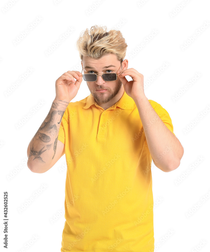 Fototapeta premium Young man with stylish sunglasses on white background