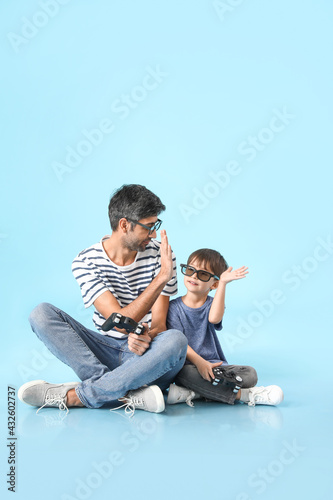 Father and little son playi...