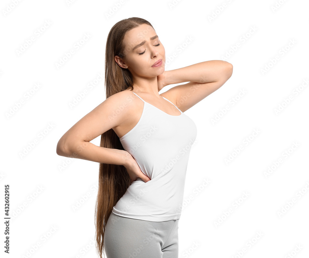 Young woman suffering from back pain on white background Young woman suffering from back pain on white background