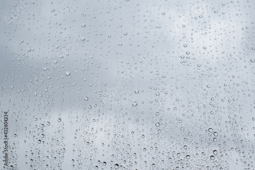 Many raindrops on the window, close-up. Rainy bad weather.